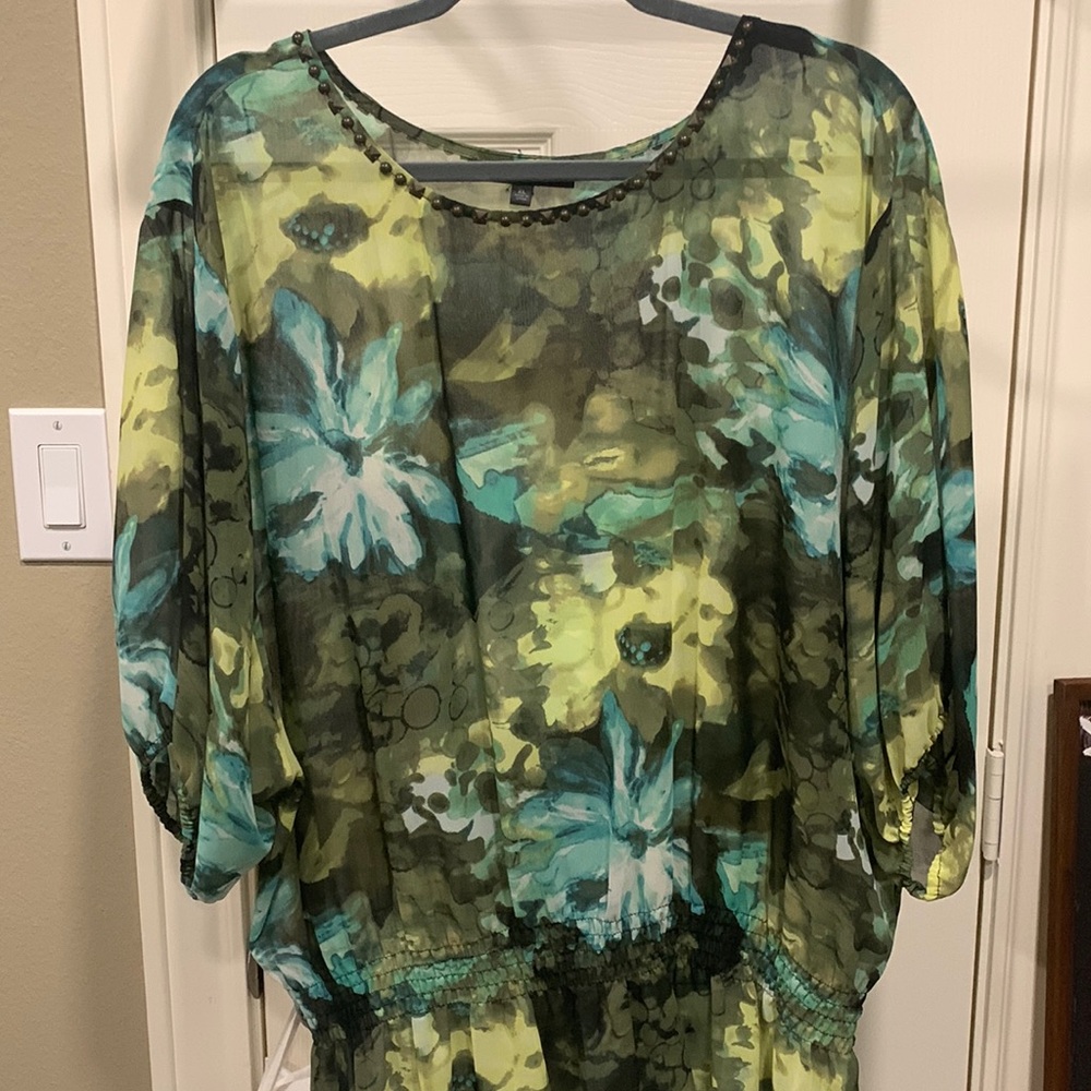 Chaus sheer floral top. Elastic smocked waist. Studded  neckline.
